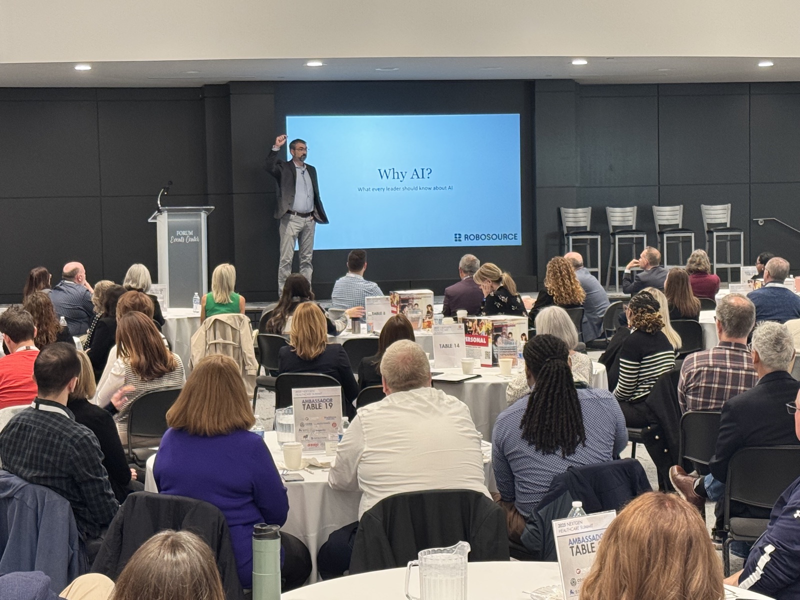 Jason Beutler opening a 'Why AI?' keynote to a full room